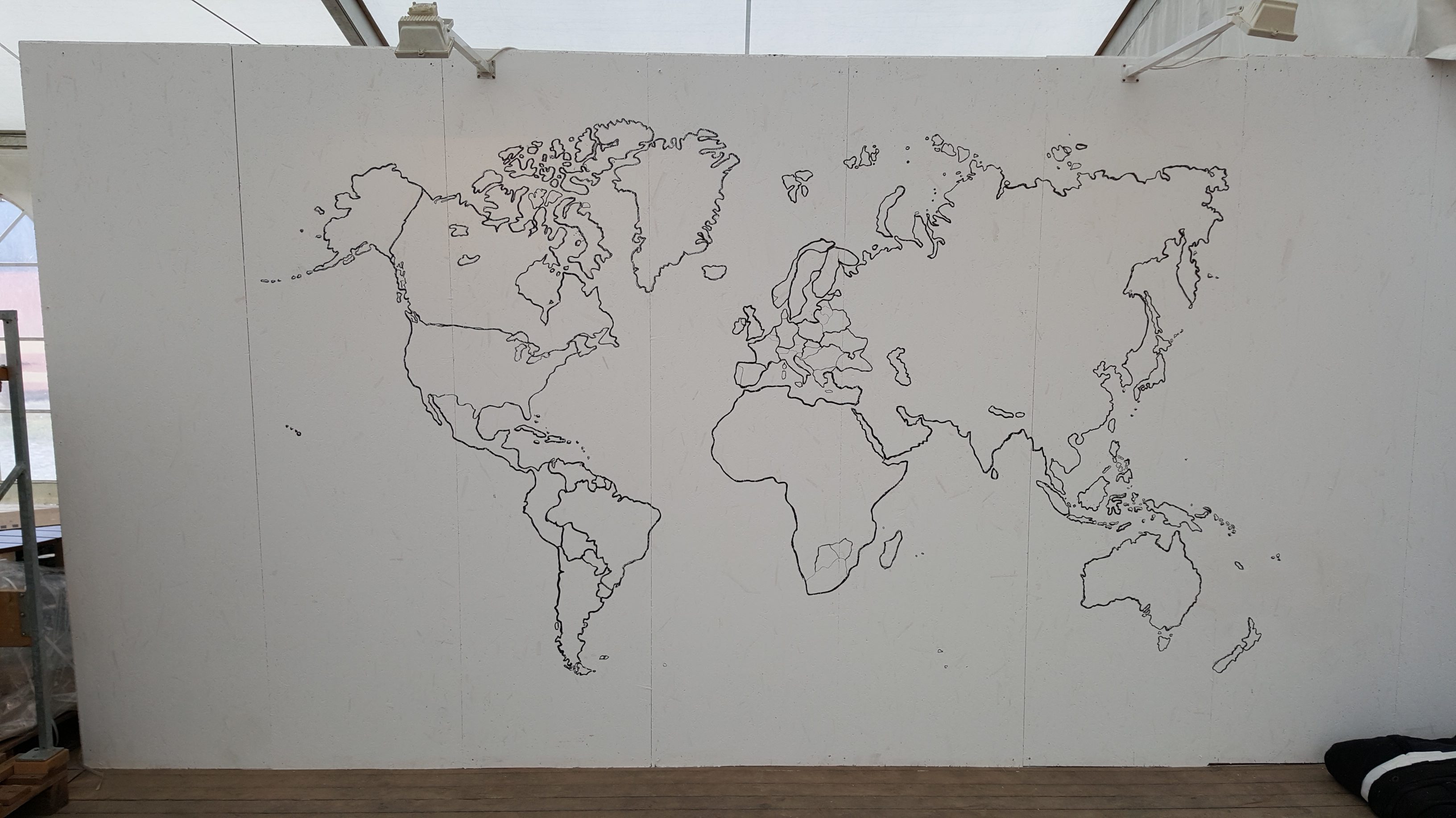This wall in the dining tent is decorated with a world map in recognition of our internationality