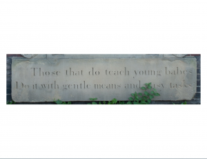 The quotation underneath the image of teacher and students