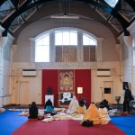 Students of Lama Ole Nydahl meditating in the main hall of the Buddhist centre