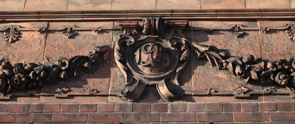 The rosetta over the door of the Beaufoy Institute, showing the date it was completed
